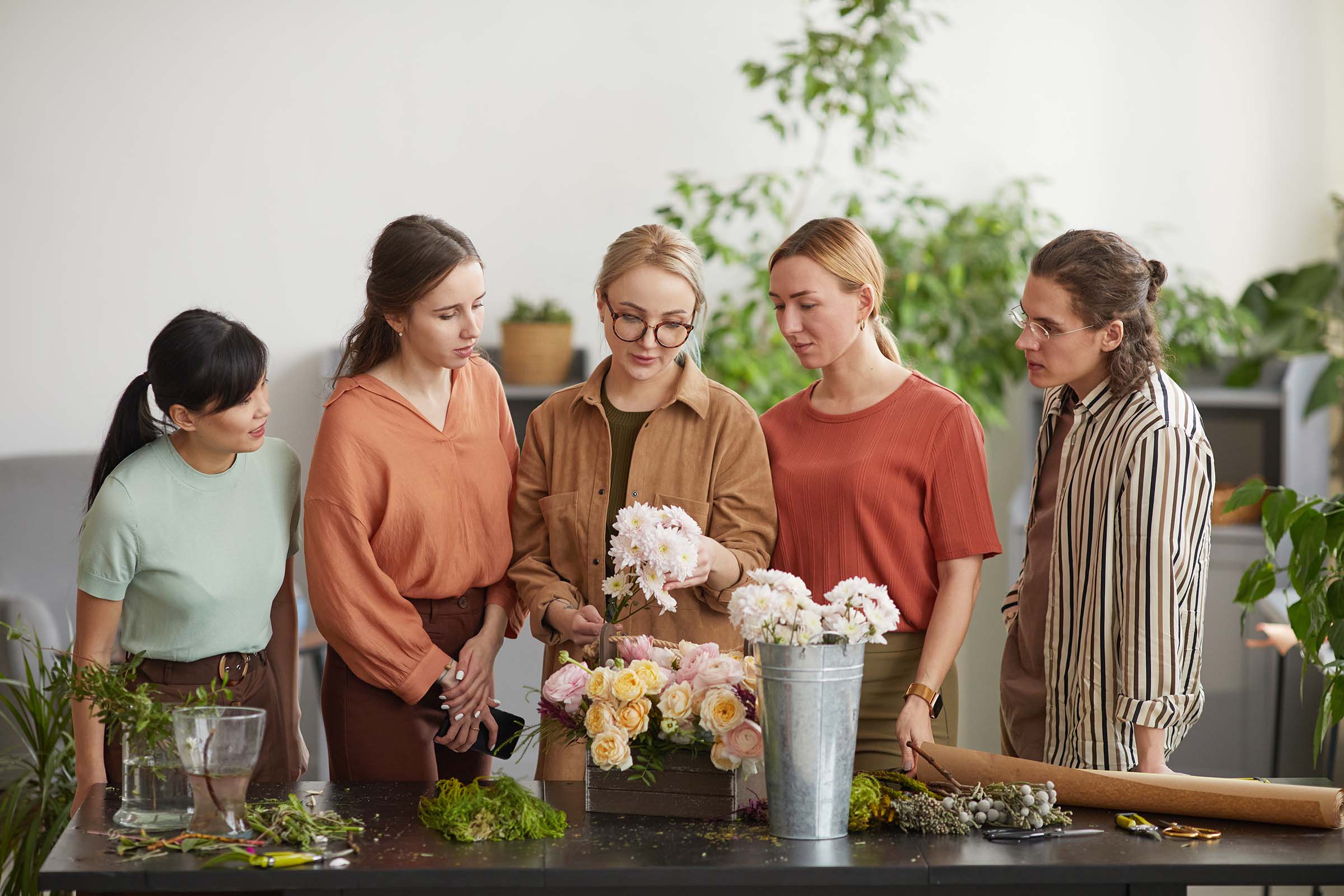 A group taking part in a floral workshop at Bristol Floral Design